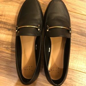 Black dress shoes with gold accent